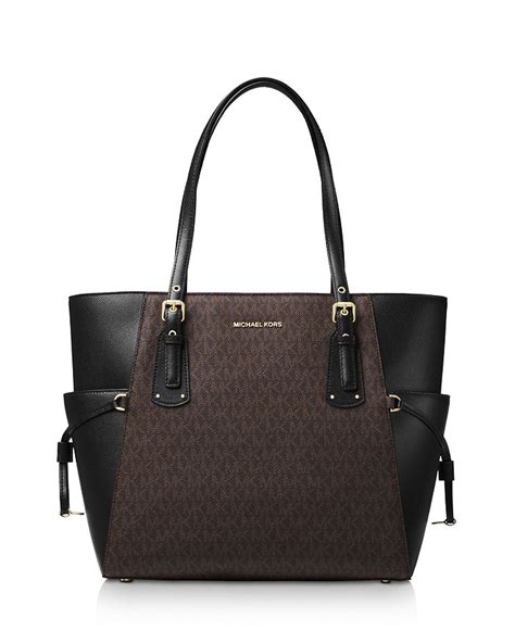 michael kors voyager east west tote graphite|Michael Kors voyager tote merlot.